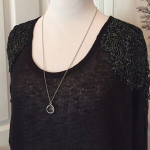 Look at the back of this Charming Charlie sweater